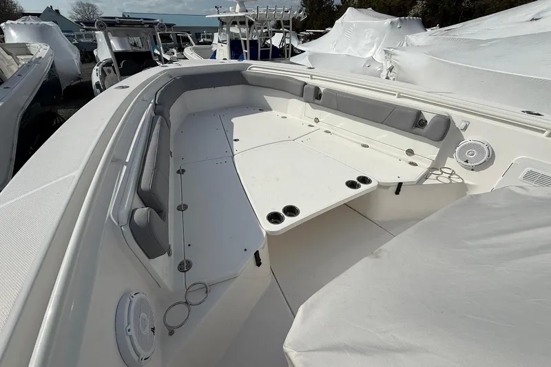 Slide: The Image of 2017 Everglades 355 Center Console boat interior with seating and cup holders. - 15