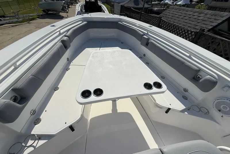 Slide: The Image of 2017 Everglades 355 Center Console boat interior with seating and table. - 22