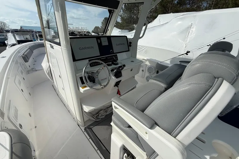 Slide: The Image of 2017 Everglades 355 Center Console boat interior with Garmin navigation system. - 6