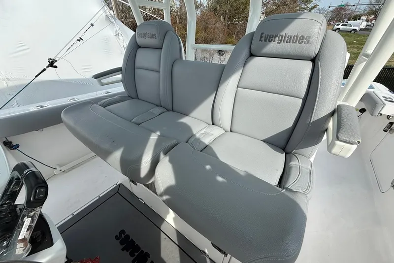 Slide: The Image of 2017 Everglades 355 Center Console boat with gray cushioned seating and branded headrests. - 7
