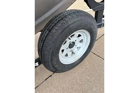 Slide: The Image of 2018 Tracker Pro Team 175 TXW trailer tire on pavement. - 10