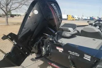 Slide: The Image of 2018 Tracker Pro Team 175 TXW boat with Mercury outboard motor, parked outdoors. - 3
