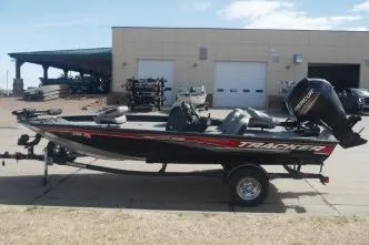 Slide: The Image of 2018 Tracker Pro Team 175 TXW boat on trailer, parked outside a building. - 4