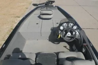 Slide: The Image of 2018 Tracker Pro Team 175 TXW boat interior with steering console and seating. - 5