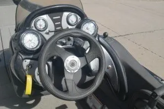 Slide: The Image of 2018 Tracker Pro Team 175 TXW boat dashboard with steering wheel and gauges. - 6