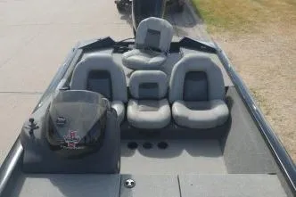 Slide: The Image of 2018 Tracker Pro Team 175 TXW boat interior with seating and steering console. - 7