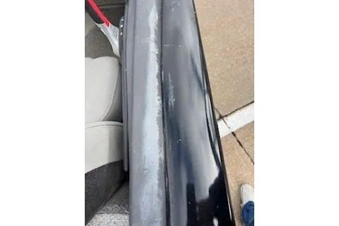 Slide: The Image of 2018 Tracker Pro Team 175 TXW boat showing wear on the black exterior surface. - 8