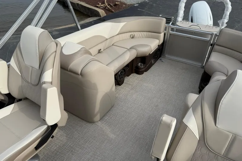 Slide: The Image of 2026 Avalon LSZ Quad Lounge 23' boat interior with beige seating and modern design. - 10