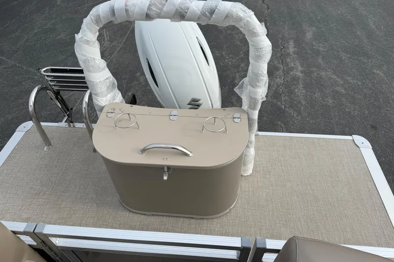 Slide: The Image of 2026 Avalon LSZ Quad Lounge boat deck with wrapped railing and motor. - 17