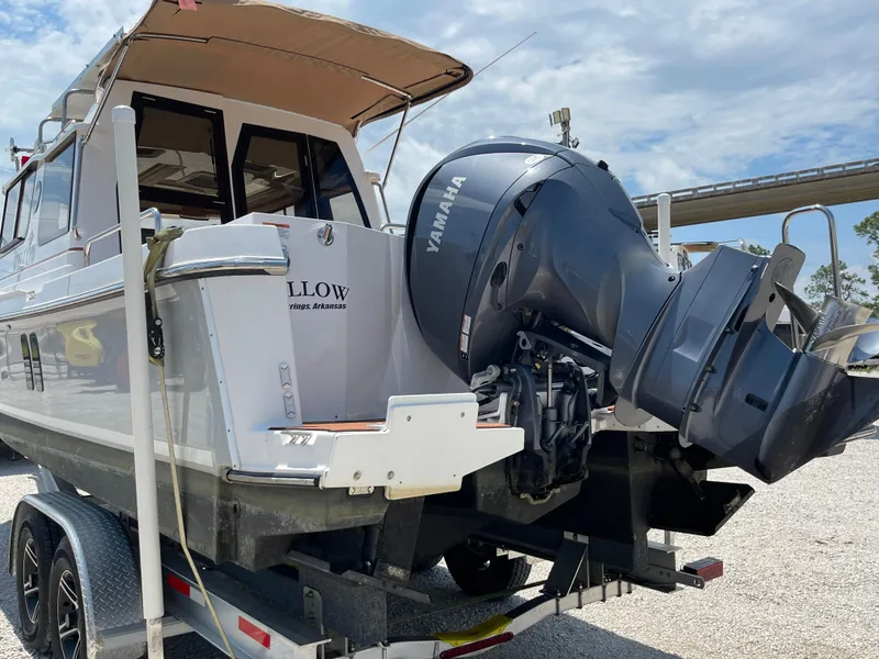 Slide: The Image of 2024 Ranger Tugs R-25 boat with Yamaha outboard motor on trailer. - 5