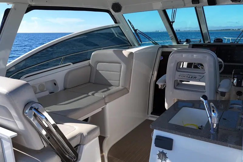 Slide: The Image of Interior of 2016 Boston Whaler 345 Conquest boat with seating and ocean view. - 17