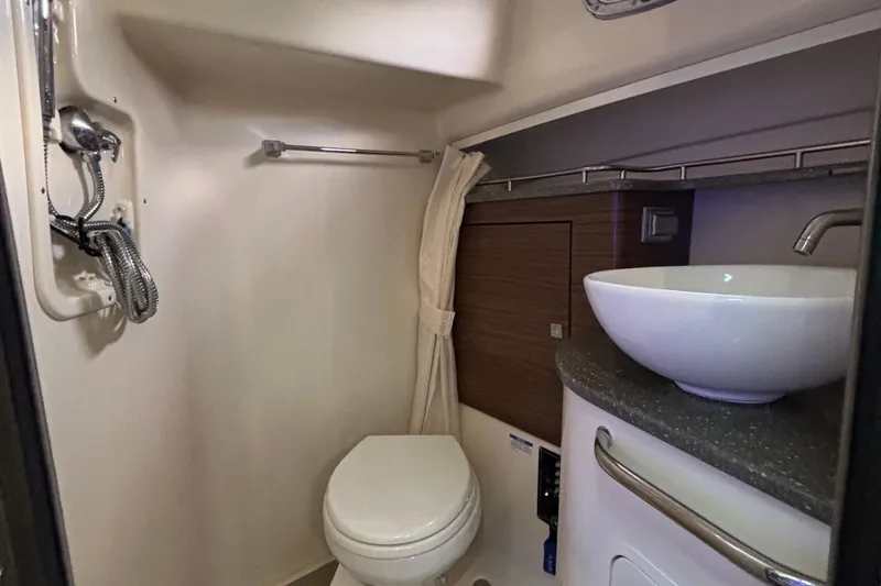 Slide: The Image of 2016 Boston Whaler 345 Conquest bathroom with modern sink and toilet. - 23