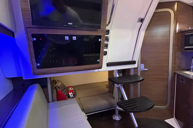 Slide: The Image of Interior of 2016 Boston Whaler 345 Conquest with modern amenities and cozy seating. - 25