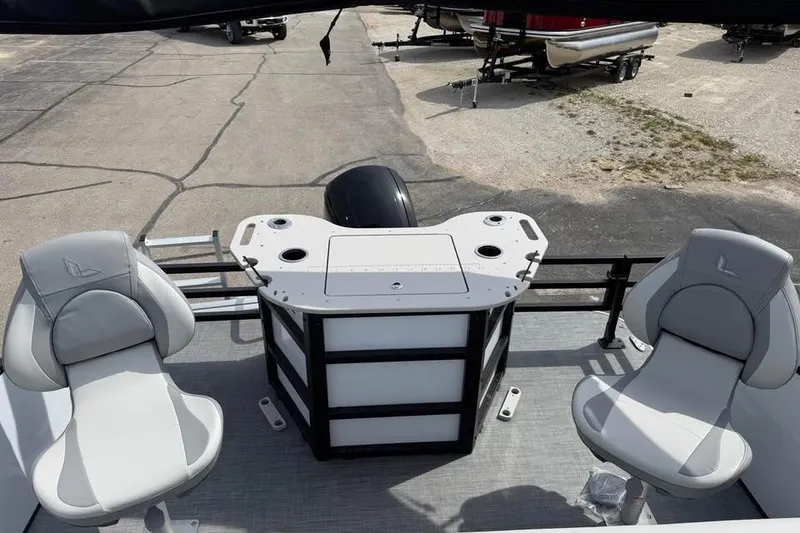 Slide: The Image of 2026 Lowe SF 232 Sport Fish boat interior with two seats and a central console. - 10