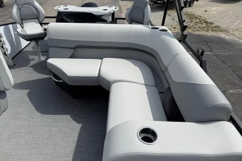 Slide: The Image of 2026 Lowe SF 232 Sport Fish boat interior with plush seating and cup holders. - 11