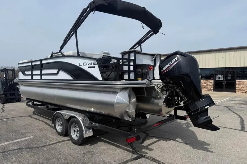 Slide: The Image of 2026 Lowe SF 232 Sport Fish pontoon boat with Mercury outboard motor on trailer. - 6