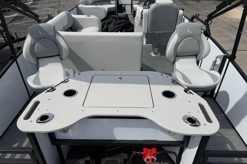 Slide: The Image of 2026 Lowe SF 232 Sport Fish boat interior with seating and fishing station. - 9