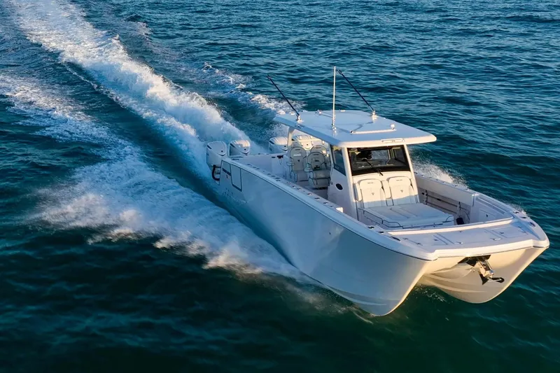 The Image of 2026 Twin Vee 400 GFX2 CC boat cruising on open sea. - 0