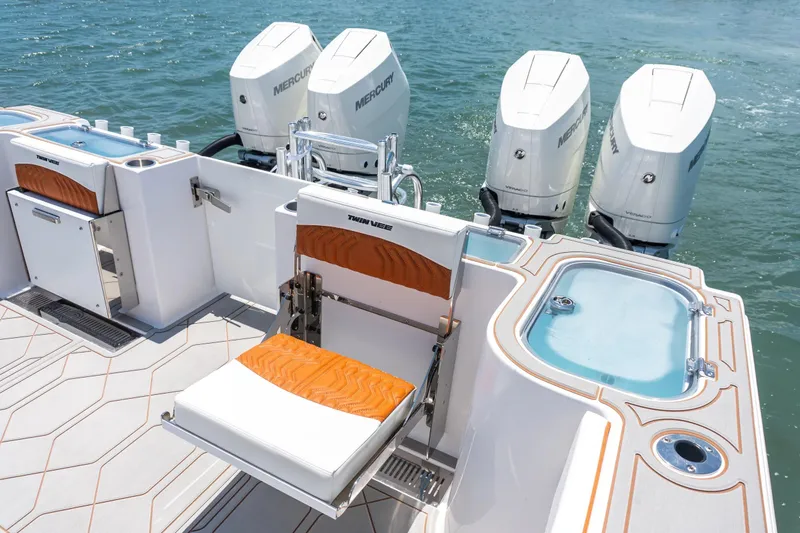 Slide: The Image of 2026 Twin Vee 400 GFX2 CC boat with four Mercury engines. - 16