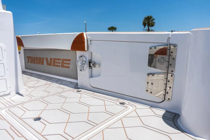 Slide: The Image of 2026 Twin Vee 400 GFX2 CC boat deck with modern design. - 17