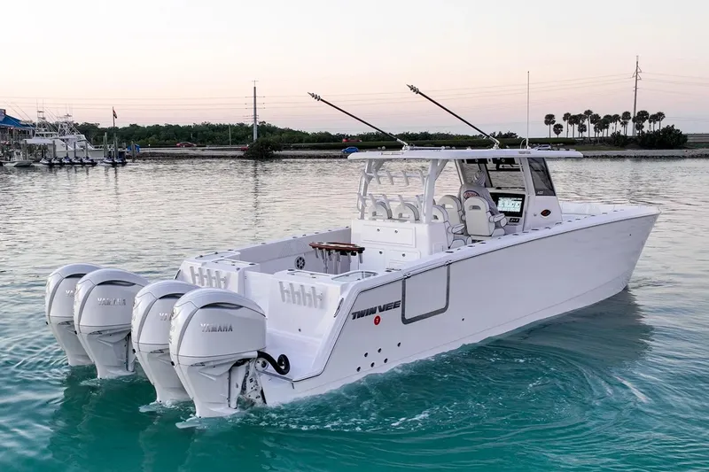 Slide: The Image of Manufacturer Provided Image: 2026 Twin Vee 400 GFX2 CC boat with triple Yamaha engines on calm water. - 3