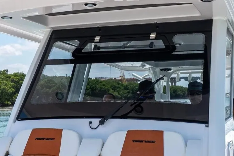 Slide: The Image of 2026 Twin Vee 400 GFX2 CC boat with modern cabin. - 8