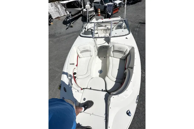 Slide: The Image of 2012 Stingray 234 LR boat with white seating and open deck, viewed from above. - 3