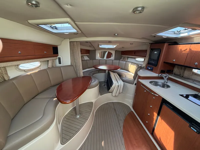 Slide: The Image of Interior of a 2003 Chaparral 330 Signature yacht with kitchen and seating area. - 10