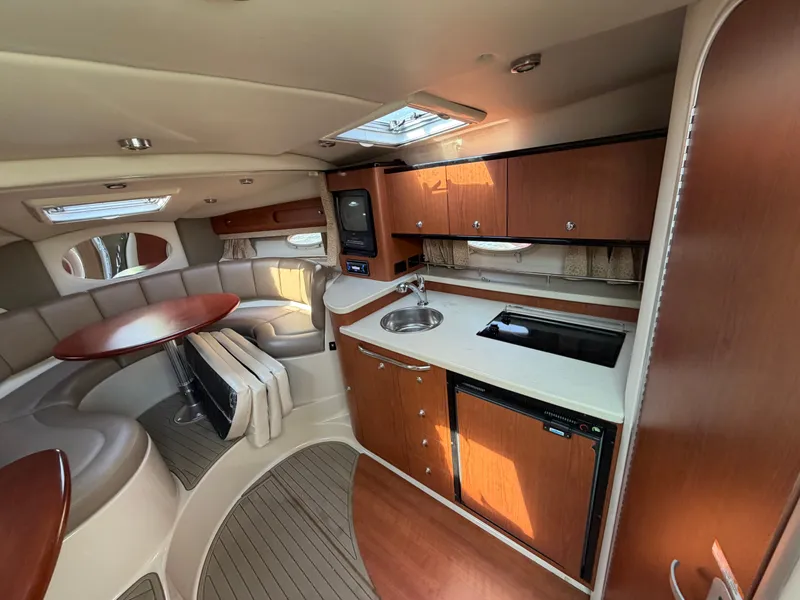 Slide: The Image of Interior of 2003 Chaparral 330 Signature with kitchen and seating area. - 12