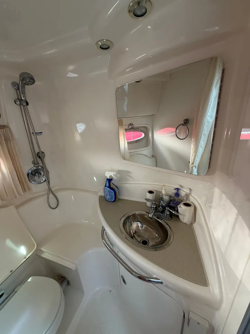 Slide: The Image of Interior of 2003 Chaparral 330 Signature, bathroom with sink and shower. - 15