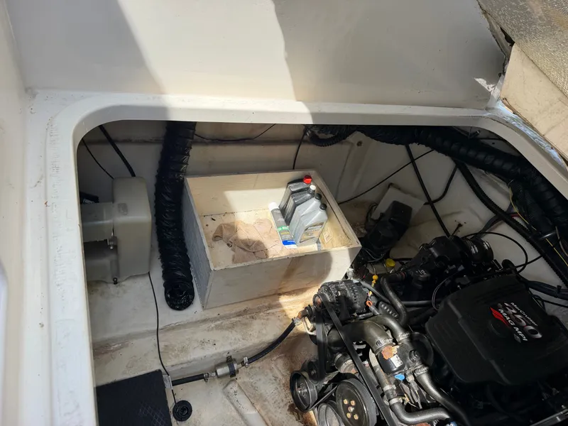 Slide: The Image of Engine compartment of a 2003 Chaparral 330 Signature boat with engine and accessories. - 20