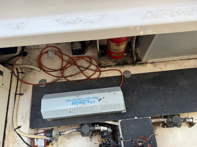 Slide: The Image of Engine compartment of 2003 Chaparral 330 Signature boat with fire extinguisher. - 21