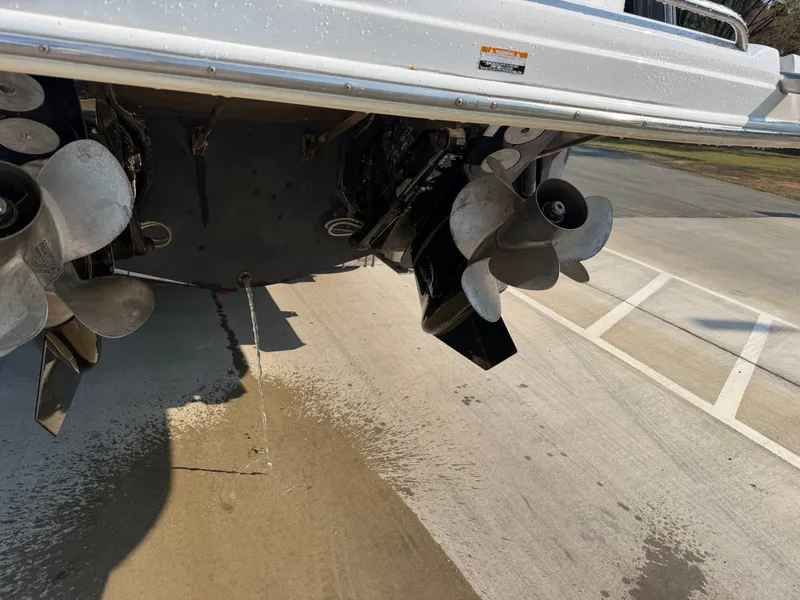 Slide: The Image of 2003 Chaparral 330 Signature boat hull with propellers on concrete surface. - 22