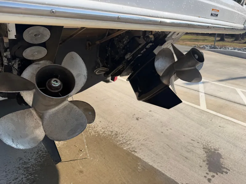 Slide: The Image of Propeller of a 2003 Chaparral 330 Signature boat on a parking lot. - 25