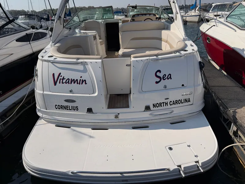 Slide: The Image of 2003 Chaparral 330 Signature boat docked, named "Vitamin Sea". - 4
