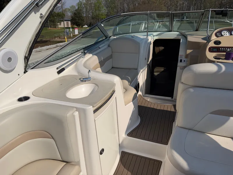 Slide: The Image of Interior of a 2003 Chaparral 330 Signature yacht with seating area and sink. - 6