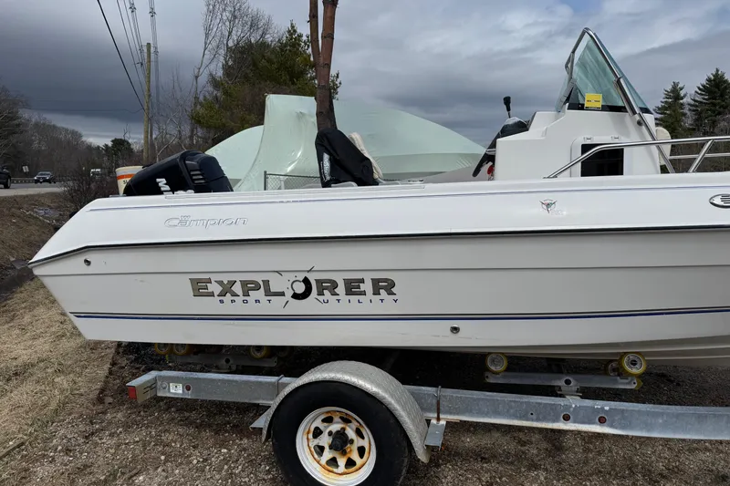 Slide: The Image of 2005 Campion Explorer 582 Center Console boat on trailer, parked outdoors. - 1