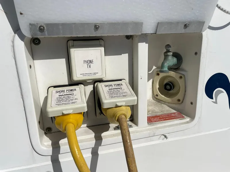 Slide: The Image of Shore power connections on a 1989 Sea Ray 420 boat. - 11