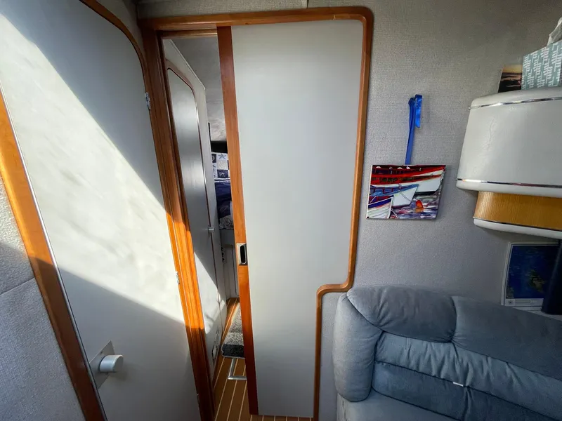 Slide: The Image of Interior of 1989 Sea Ray 420 yacht with cozy seating and modern decor. - 18