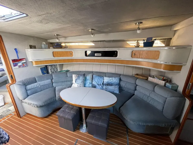 Slide: The Image of 1989 Sea Ray 420 yacht interior with cozy seating and modern decor. - 3