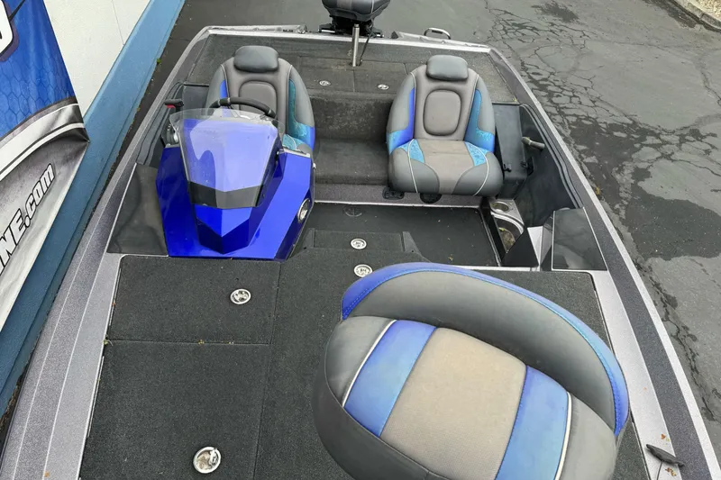 Slide: The Image of 2017 Ranger Z185 boat interior with blue and gray seating. - 12