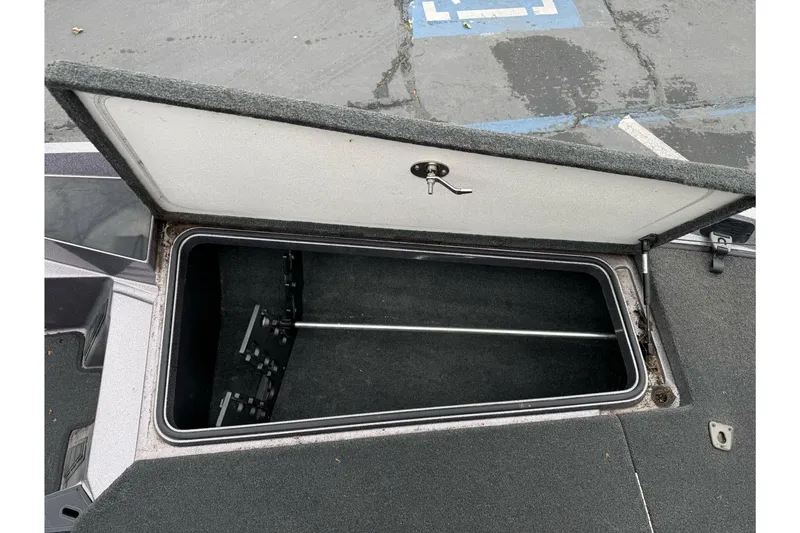 Slide: The Image of Open storage compartment on a 2017 Ranger Z185 boat, showing interior space. - 15