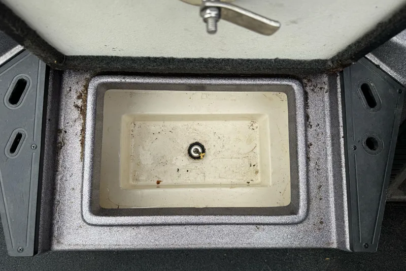 Slide: The Image of Open storage compartment in a 2017 Ranger Z185 boat, showing interior details. - 17