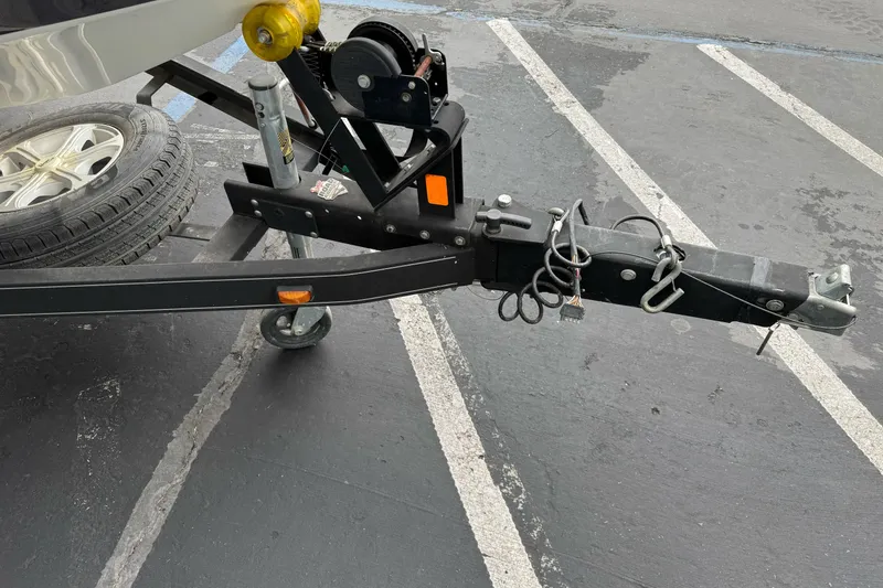 Slide: The Image of Trailer hitch of a 2017 Ranger Z185 boat in a parking lot. - 3