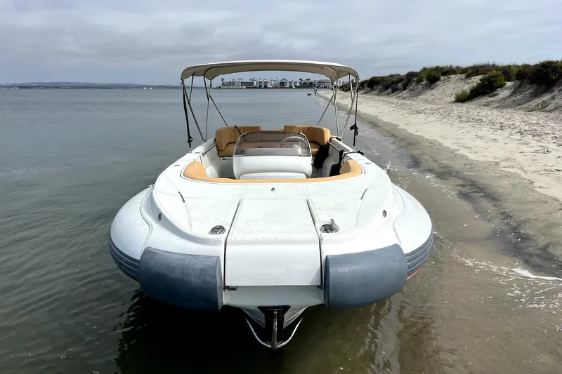 The Image of 2016 Castoldi jet tender on sandy beach, calm waters, overcast sky. - 0