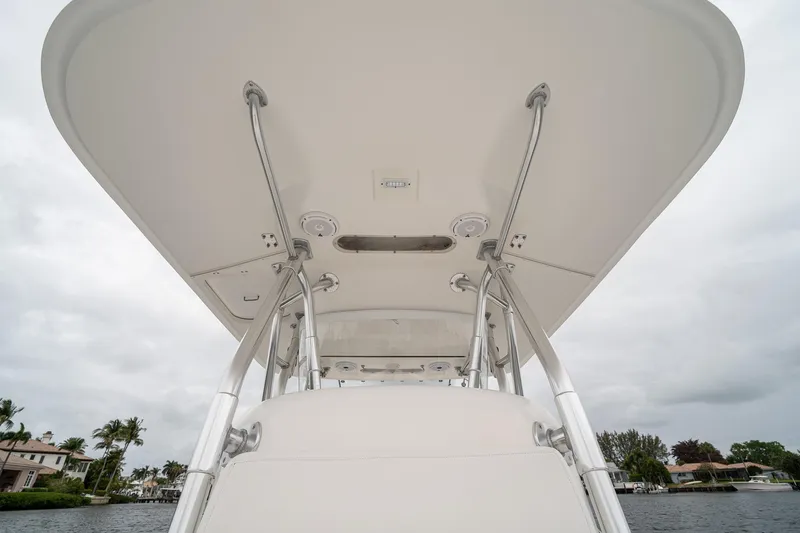Slide: The Image of 2006 Venture Center Console boat canopy with metal supports, viewed from below. - 20