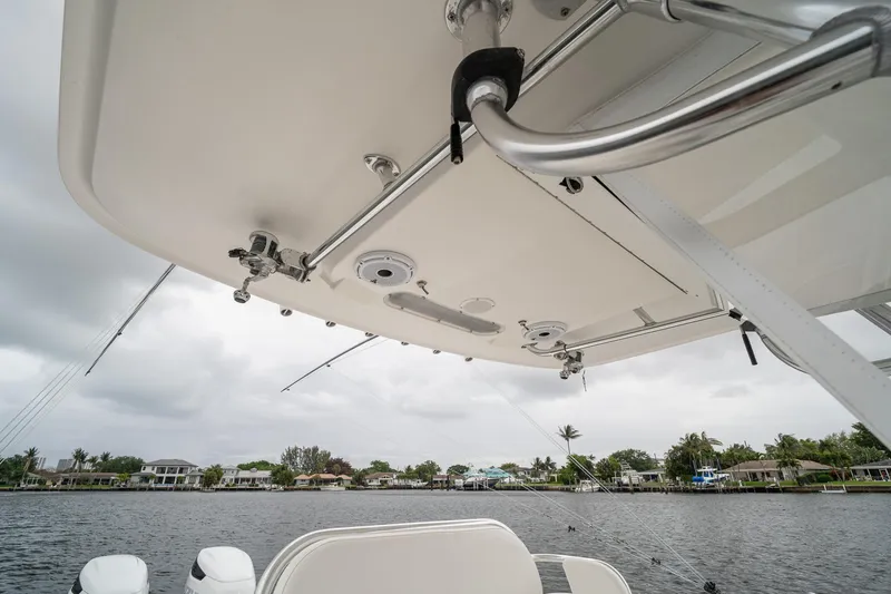 Slide: The Image of 2006 Venture Center Console boat on a calm waterway under cloudy skies. - 35