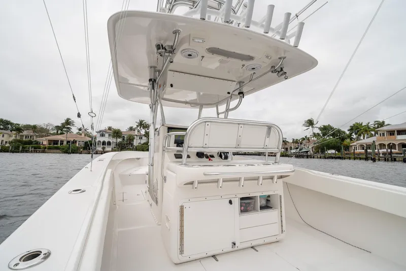 Slide: The Image of 2006 Venture Center Console boat on water, featuring spacious deck and modern amenities. - 39
