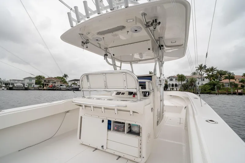 Slide: The Image of 2006 Venture Center Console boat on water, featuring spacious deck and modern controls. - 43
