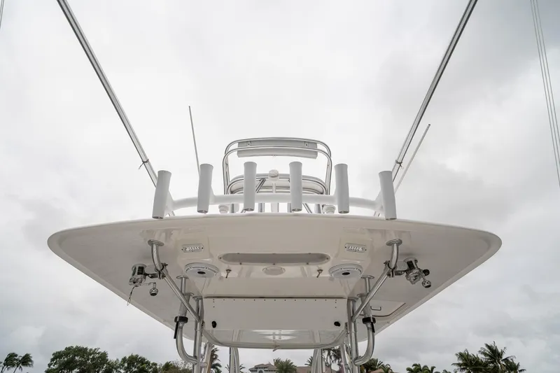 Slide: The Image of 2006 Venture Center Console boat, viewed from below against a cloudy sky. - 45